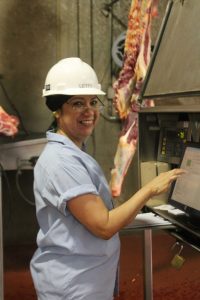 women working in beef packing